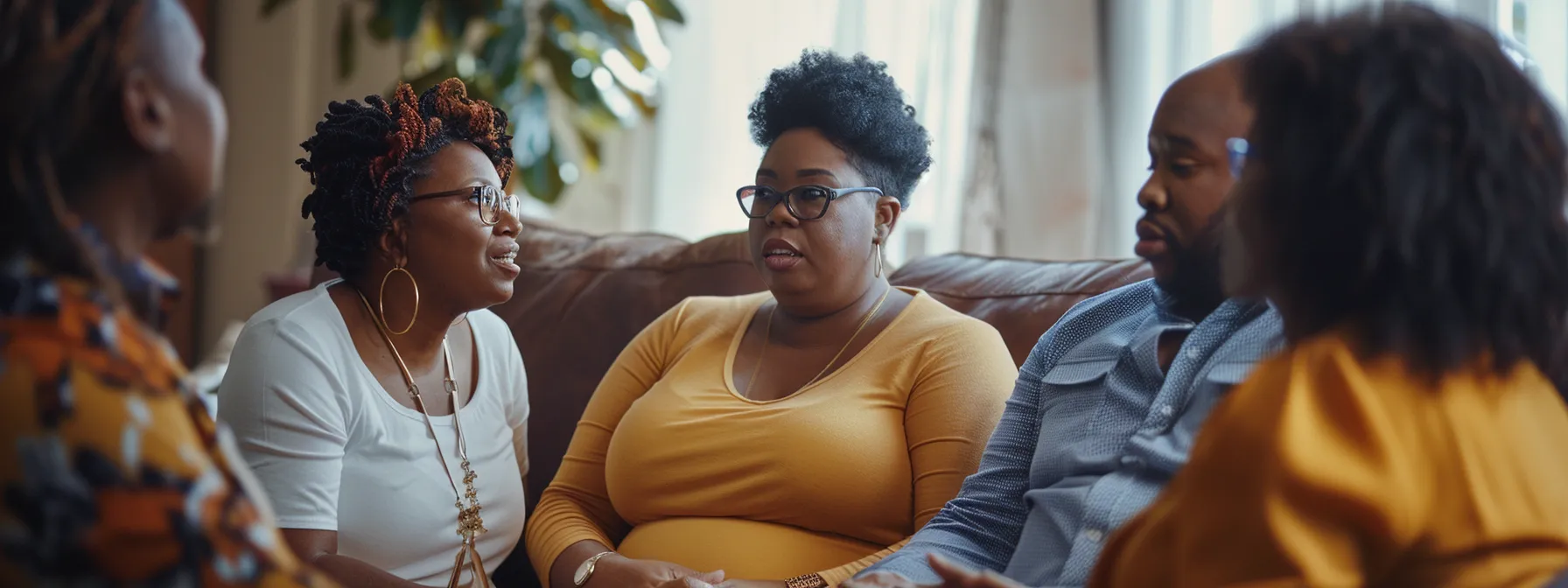 Group of diverse individuals engaged in a supportive conversation about weight loss journeys, emphasizing community and shared experiences.