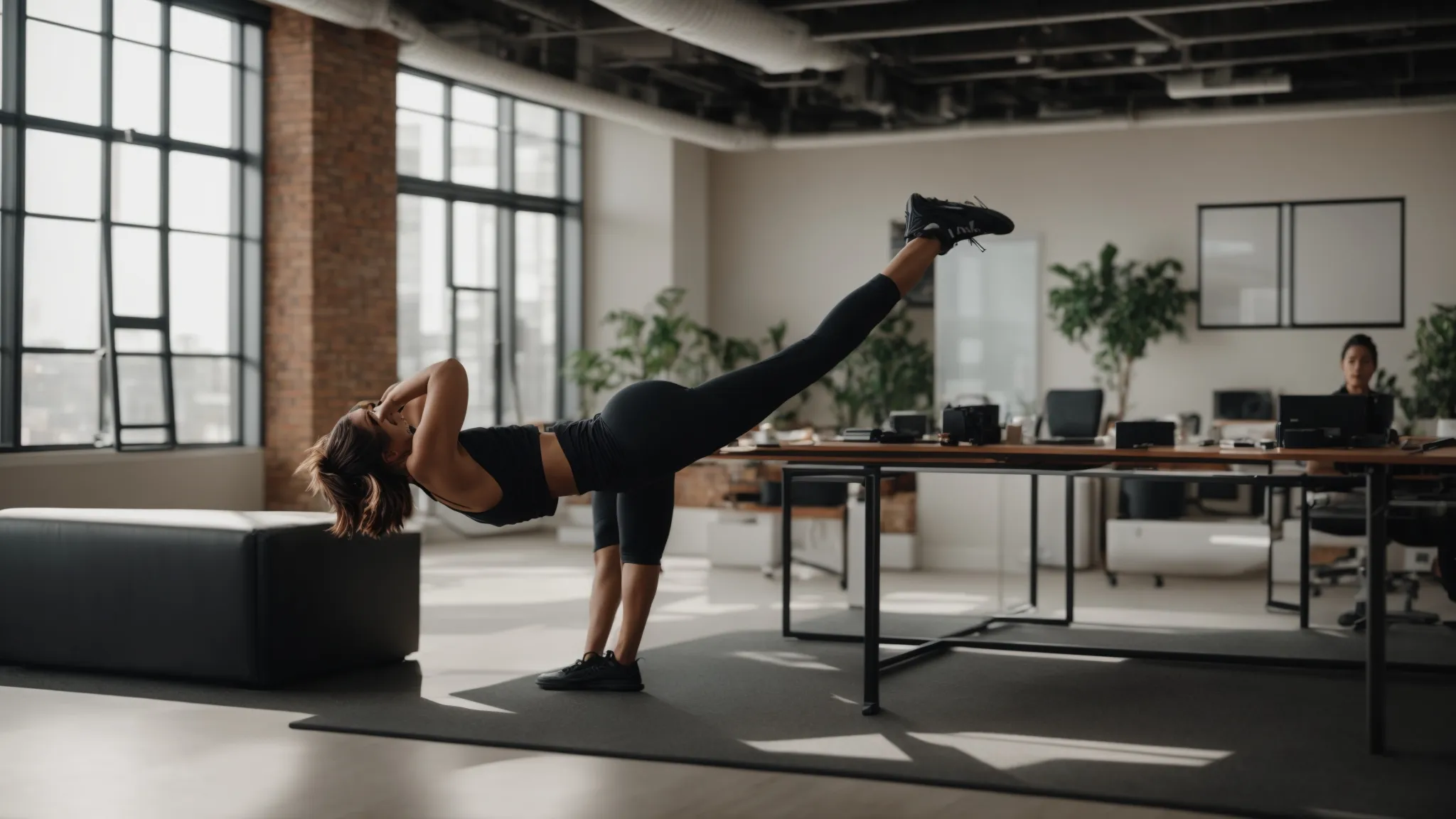 Person performing dynamic stretching exercise in a modern office setting, emphasizing flexibility and fitness integration into daily routines for weight loss and energy.